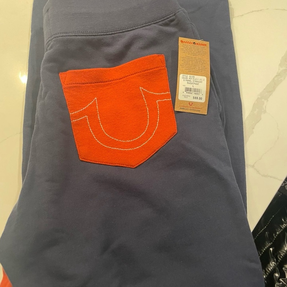 True Religion Navy Pants with Vibrant Orange Pocket